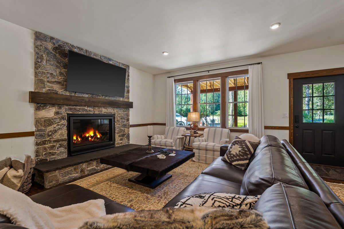 Living room with stone fireplace
