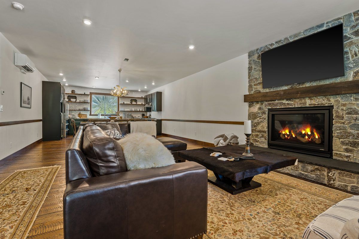 Leather sofas by the fireplace